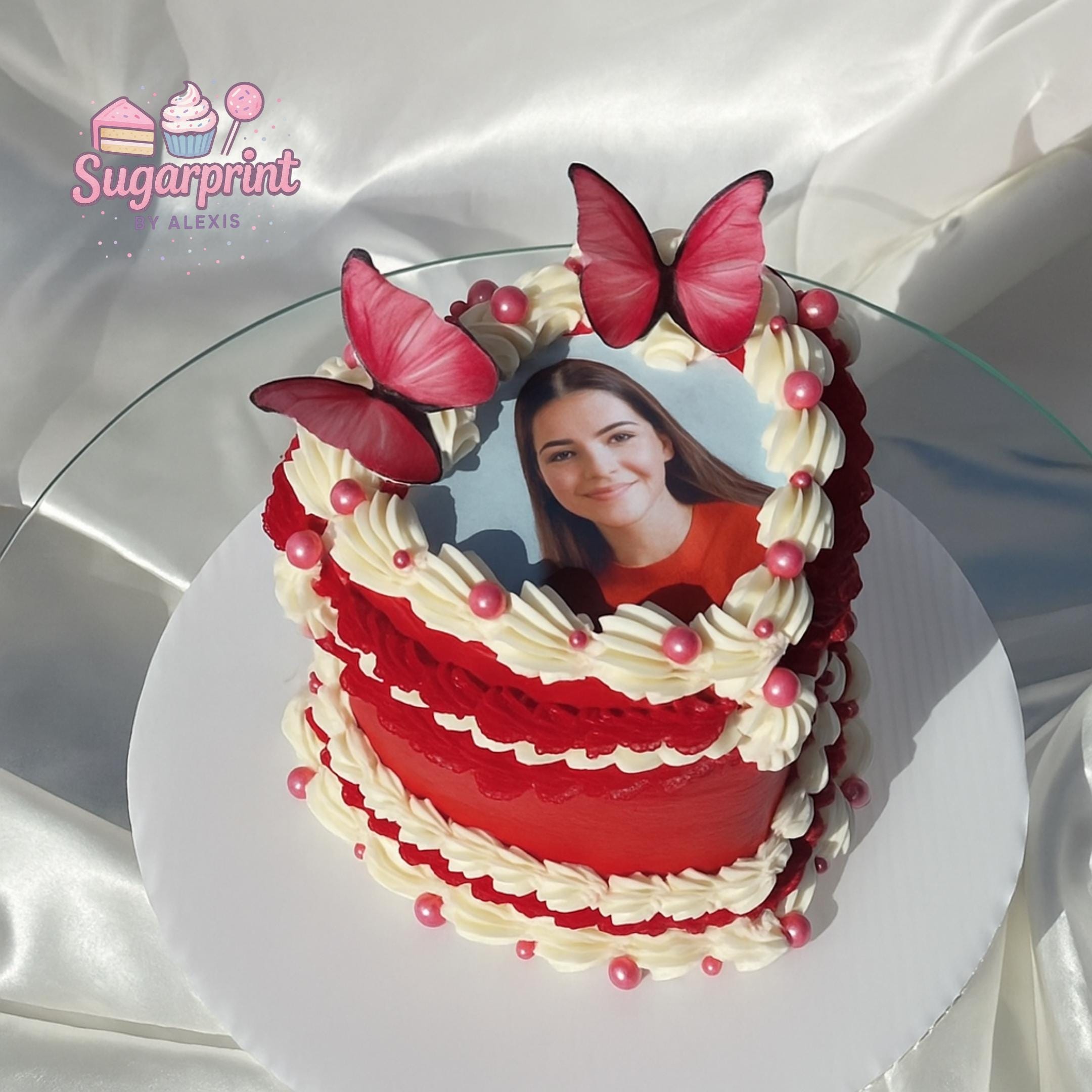 Custom heart photo edible cake topper printed on frosting sheet, ready to place on cake
