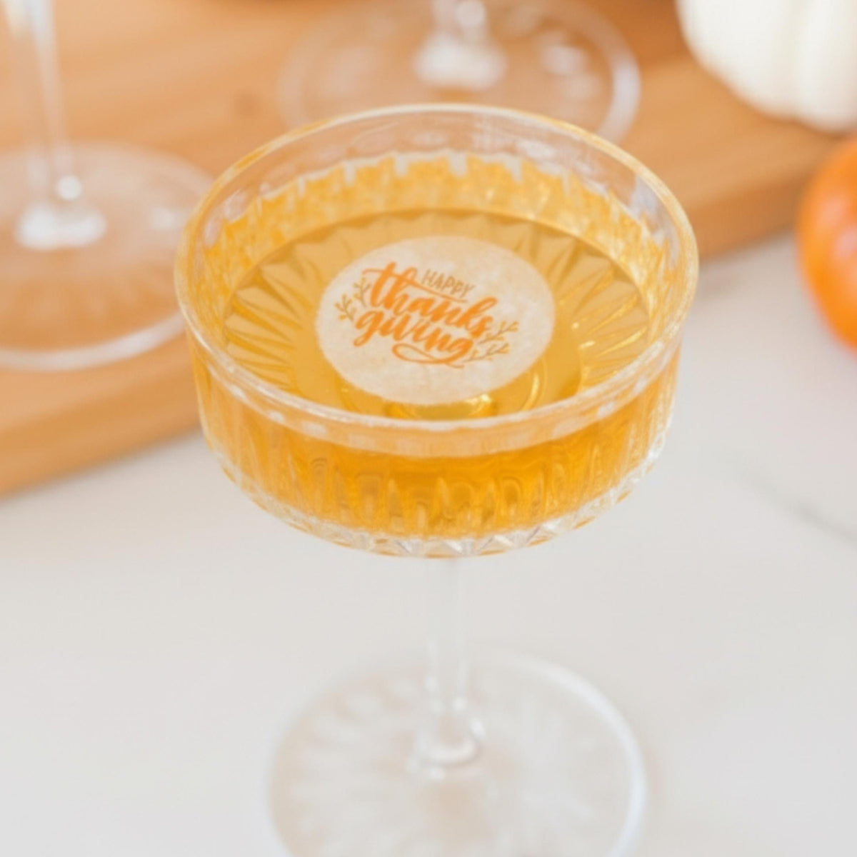 Edible wafer paper drink topper with fall Thanksgiving and Friendsgiving designs for cocktails and fall party beverages.