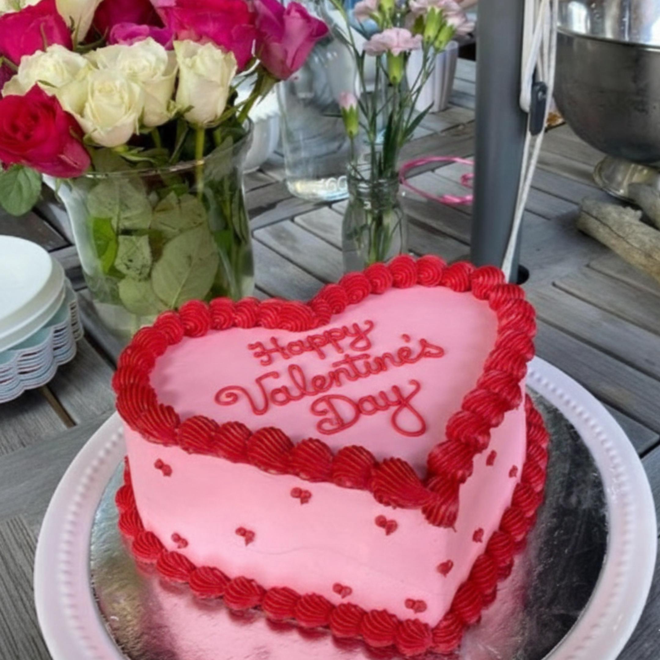 Happy Valentine’s Day red script round edible icing topper on white background.