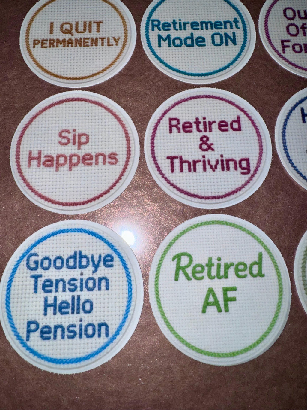 Funny Retirement edible cupcake toppers featuring 2-inch cross-stitch-inspired designs with humorous messages like “Officially Retired” and “No Alarm No Emails.” Set of 12 toppers printed on wafer paper or frosting sheets, fully edible and safe for cupcakes, cookies, and small cakes. Perfect for retirement parties, office farewell celebrations, and themed desserts, adding a playful and memorable touch to any dessert table