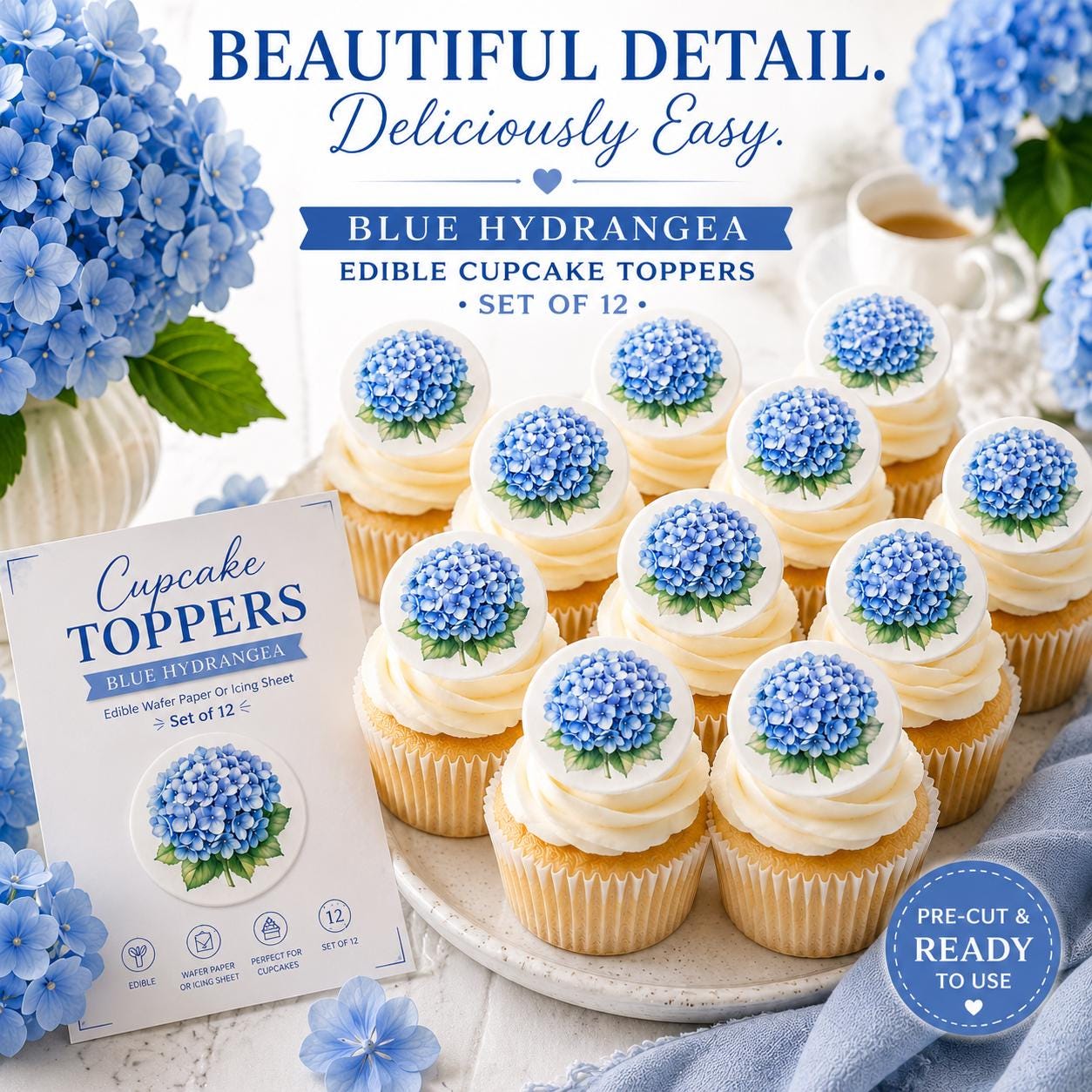 Elegant blue hydrangea themed dessert table featuring cupcakes with edible flower toppers, soft blue floral décor, tea cup accents, and styled party setting for weddings, showers, or celebrations.