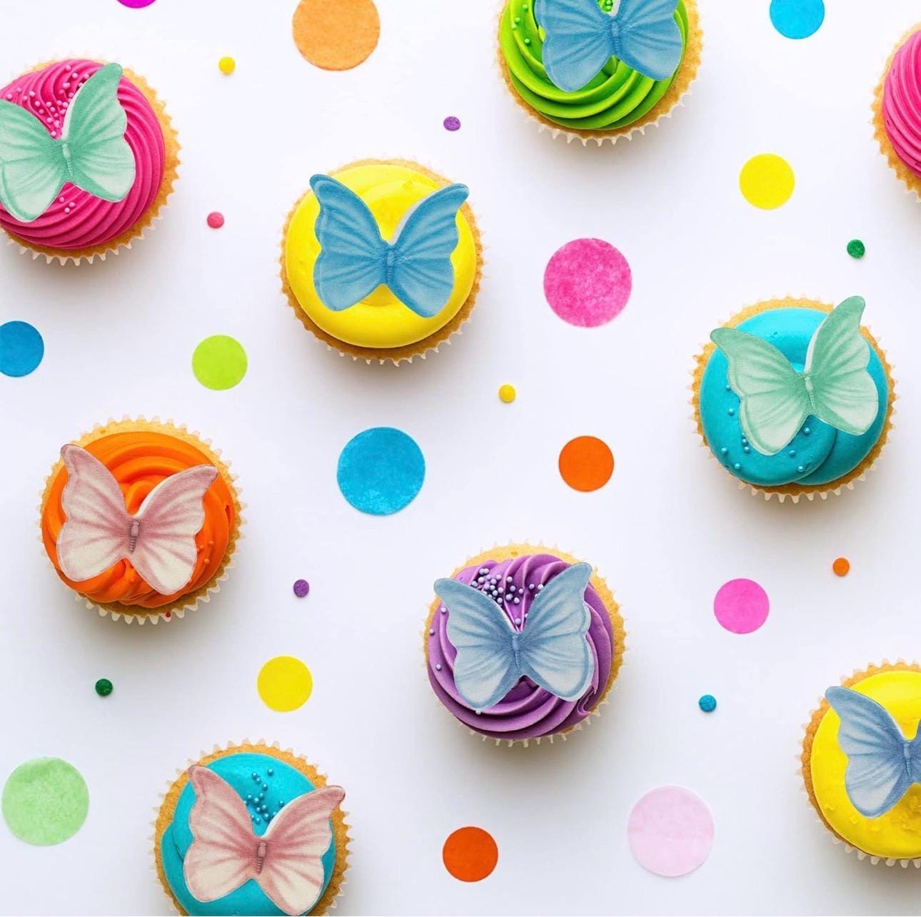 Colorful edible butterfly cake toppers made from rice wafer paper, featuring assorted sizes and vibrant designs. Set of 40 pre-cut butterflies for decorating cakes, cupcakes, cookies, desserts, fruit platters, and party treats. Lightweight edible decorations with foldable wings for a realistic 3D effect. Perfect for weddings, birthdays, baby showers, bridal showers, princess parties, anniversaries, and spring or summer themed celebrations.