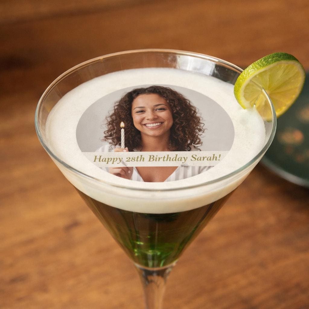 Custom photo birthday drink topper floating on cocktail, edible wafer paper circle printed with food-safe ink, perfect for milestone birthdays, anniversaries, bachelorette parties, and fun celebrations. 2-inch size for standard glasses, precut and ready to serve, adds personalized and memorable touch to party drinks