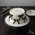 Custom edible calendar cake topper by SugarPrints featuring burn-away wafer paper reveal and personalized date decoration.