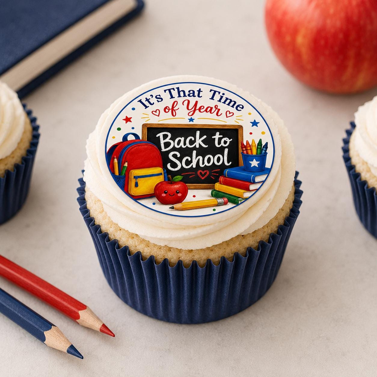 Personalized school cupcake and cookie toppers by SugarPrints on edible icing sheets, featuring colorful, pre-cut designs.