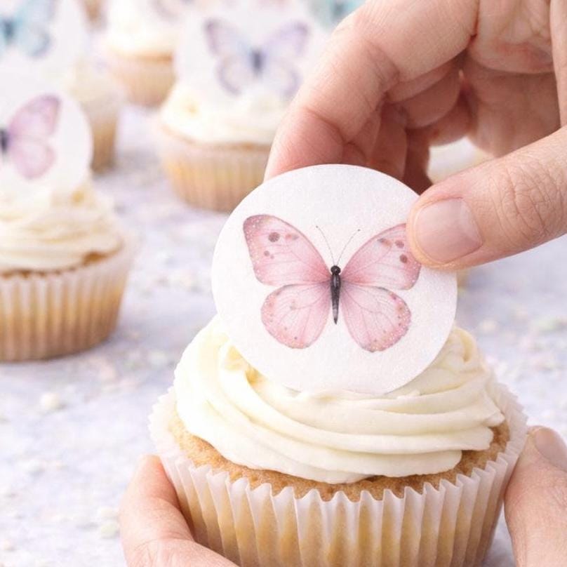 Set of 12 Butterfly Garden Party cupcake toppers by SugarPrints on edible wafer paper or frosting sheet, perfect for decorating cupcakes.