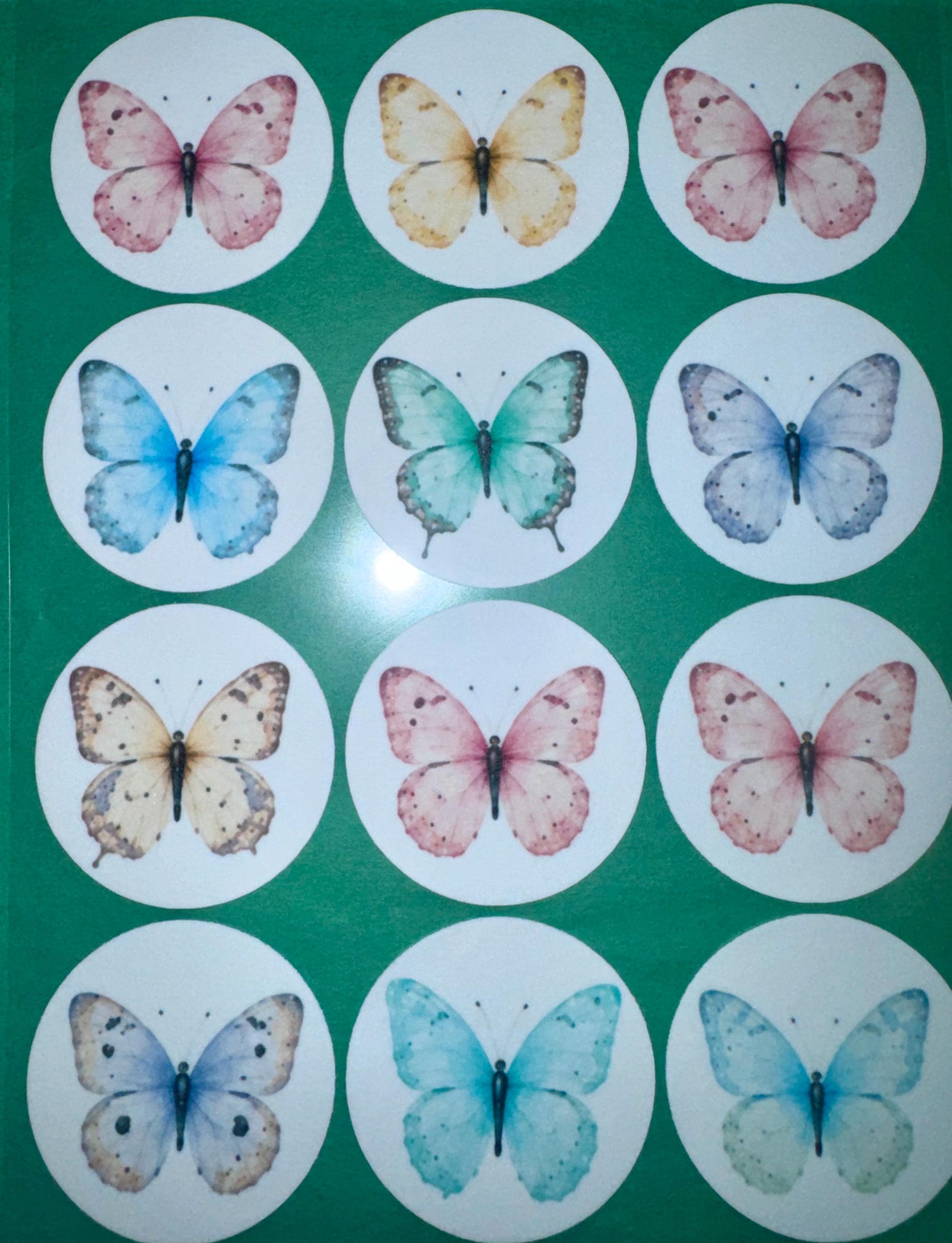 Set of 12 Butterfly Garden Party cupcake toppers made from edible wafer paper by SugarPrints by Alexis, featuring colorful butterfly designs.