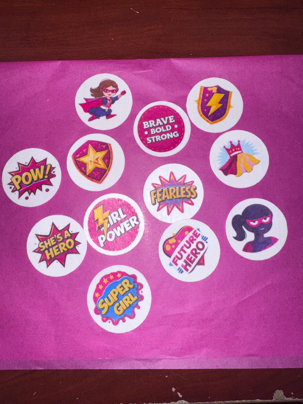 Girl superhero cupcake toppers made of edible wafer paper by SugarPrints by Alexis, perfect for birthday celebrations.