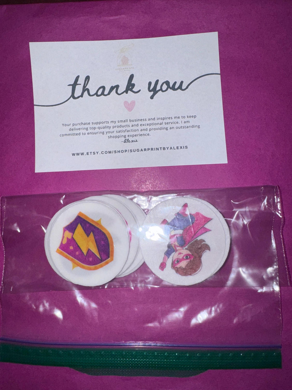 Girl superhero cupcake topper made of edible wafer paper on birthday icing sheet by SugarPrints by Alexis.