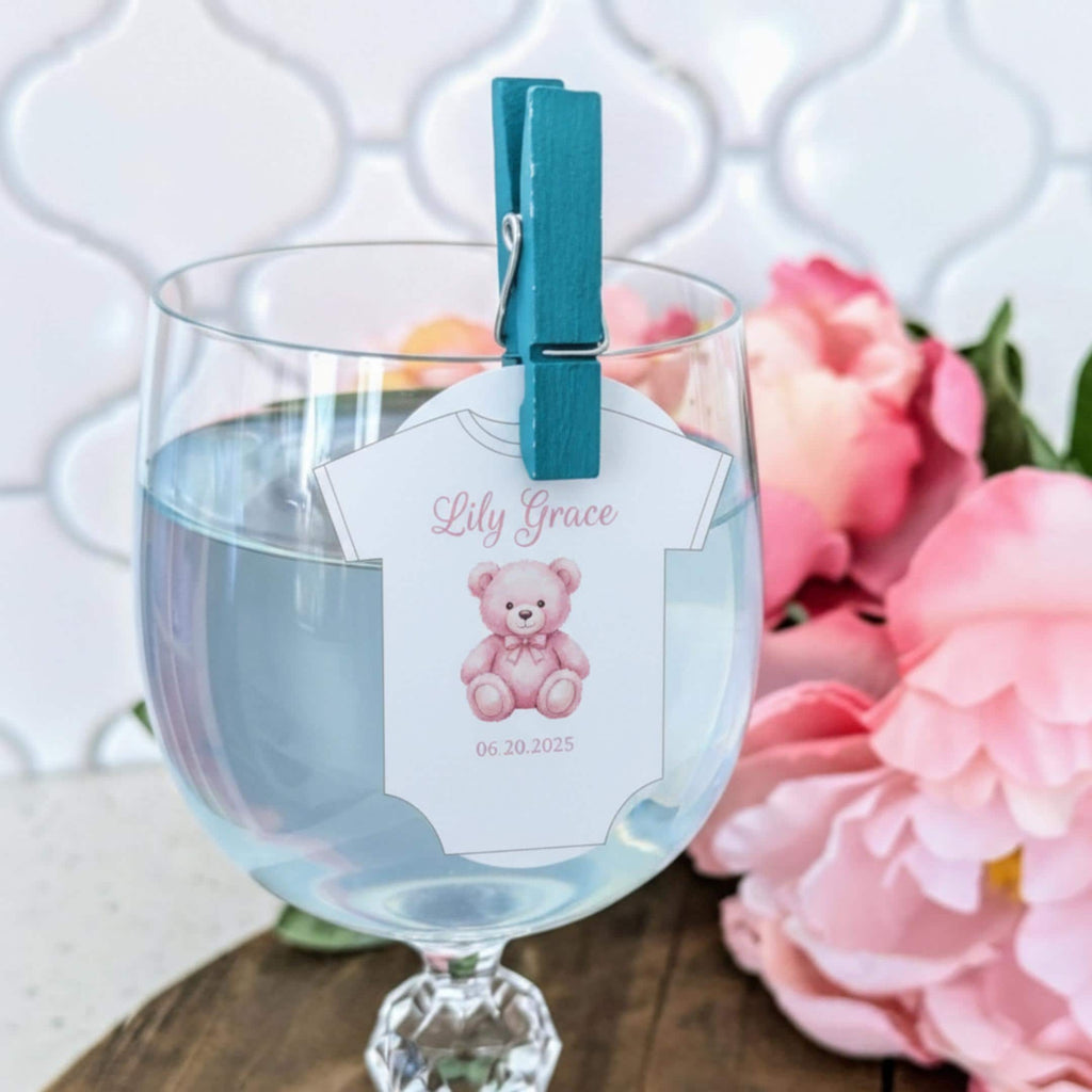 Baby shower edible drink toppers in cute onesie shape made from wafer paper, designed to float on coffee, milk foam, mocktails, and party drinks. These precut toppers are printed with food-safe edible ink, adding a soft and charming touch to baby shower, gender reveal, and welcome baby celebrations. Perfect for themed party decor, they create a stylish and photo-ready presentation while enhancing the overall event setup