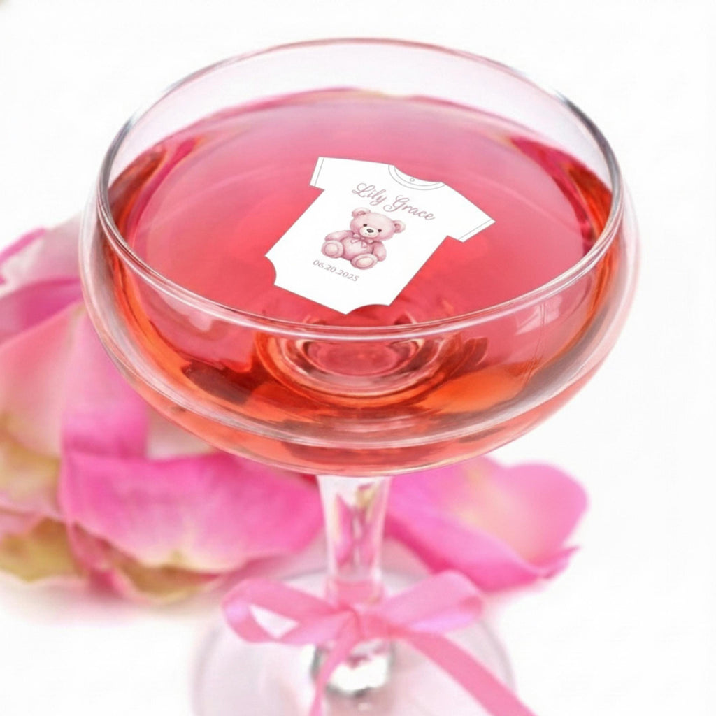Baby shower edible drink toppers in cute onesie shape made from wafer paper, designed to float on coffee, milk foam, mocktails, and party drinks. These precut toppers are printed with food-safe edible ink, adding a soft and charming touch to baby shower, gender reveal, and welcome baby celebrations. Perfect for themed party decor, they create a stylish and photo-ready presentation while enhancing the overall event setup