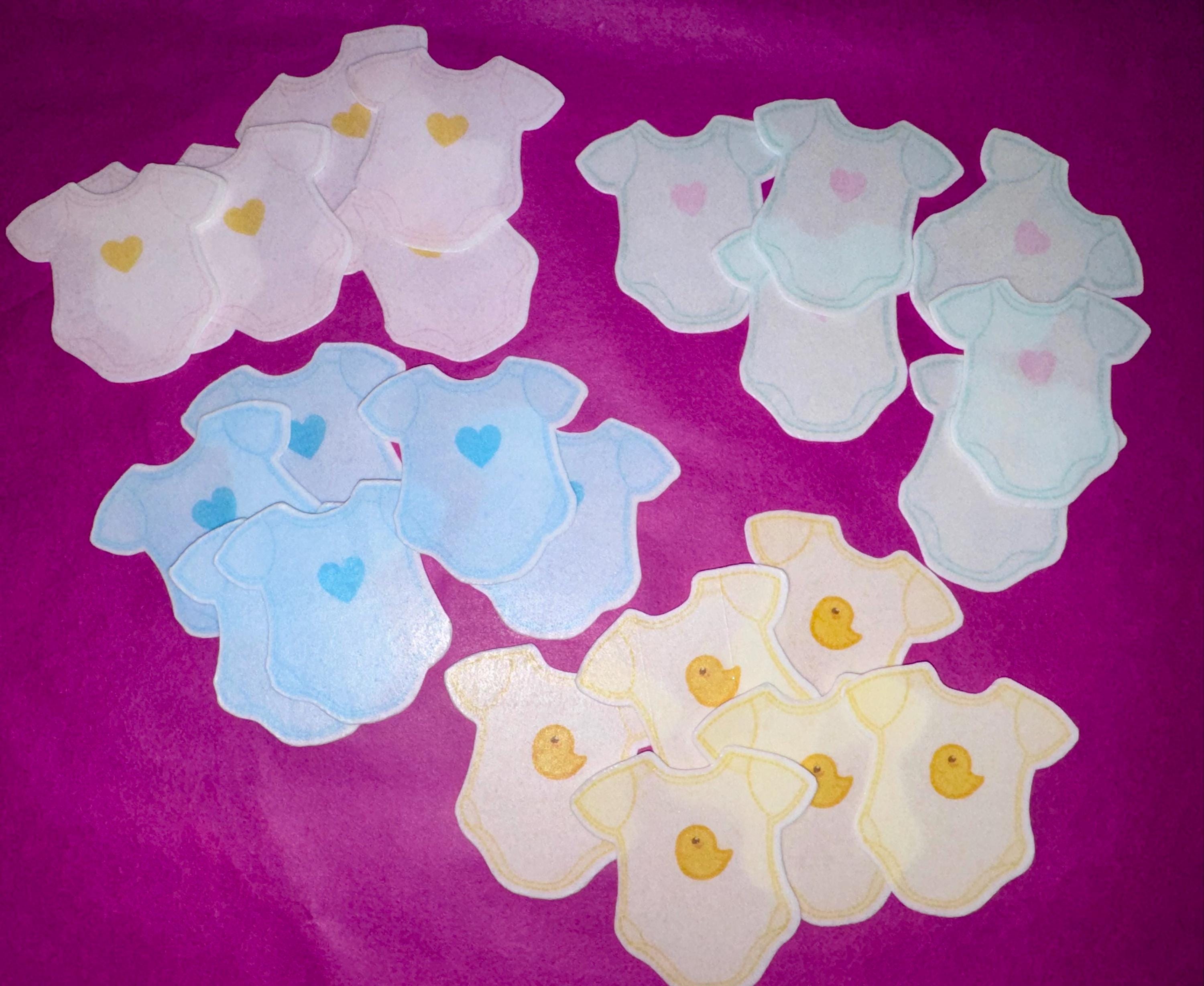 Baby shower edible drink toppers in cute onesie shape made from wafer paper, designed to float on coffee, milk foam, mocktails, and party drinks. These precut toppers are printed with food-safe edible ink, adding a soft and charming touch to baby shower, gender reveal, and welcome baby celebrations. Perfect for themed party decor, they create a stylish and photo-ready presentation while enhancing the overall event setup