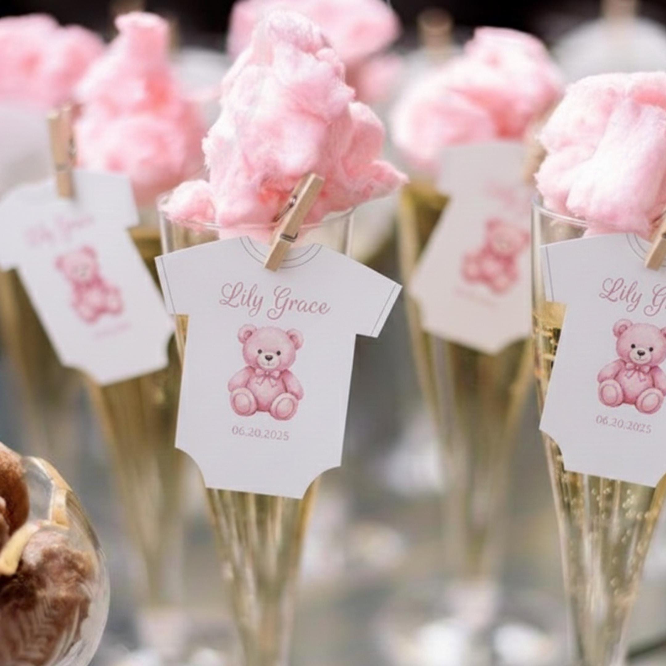 Baby shower edible drink toppers in cute onesie shape made from wafer paper, designed to float on coffee, milk foam, mocktails, and party drinks. These precut toppers are printed with food-safe edible ink, adding a soft and charming touch to baby shower, gender reveal, and welcome baby celebrations. Perfect for themed party decor, they create a stylish and photo-ready presentation while enhancing the overall event setup