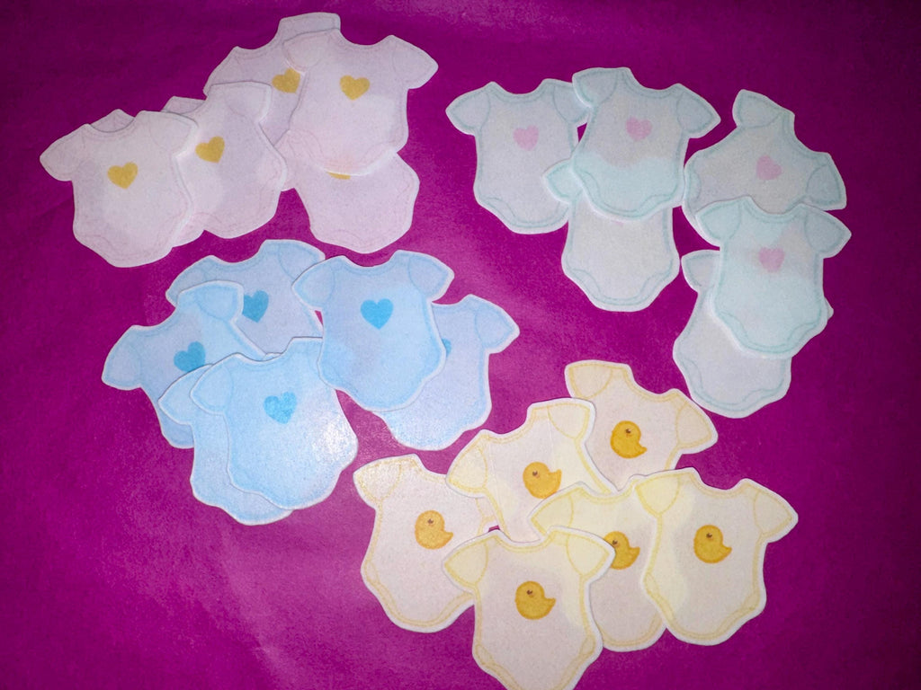 Baby shower edible drink toppers in cute onesie shape made from wafer paper, designed to float on coffee, milk foam, mocktails, and party drinks. These precut toppers are printed with food-safe edible ink, adding a soft and charming touch to baby shower, gender reveal, and welcome baby celebrations. Perfect for themed party decor, they create a stylish and photo-ready presentation while enhancing the overall event setup