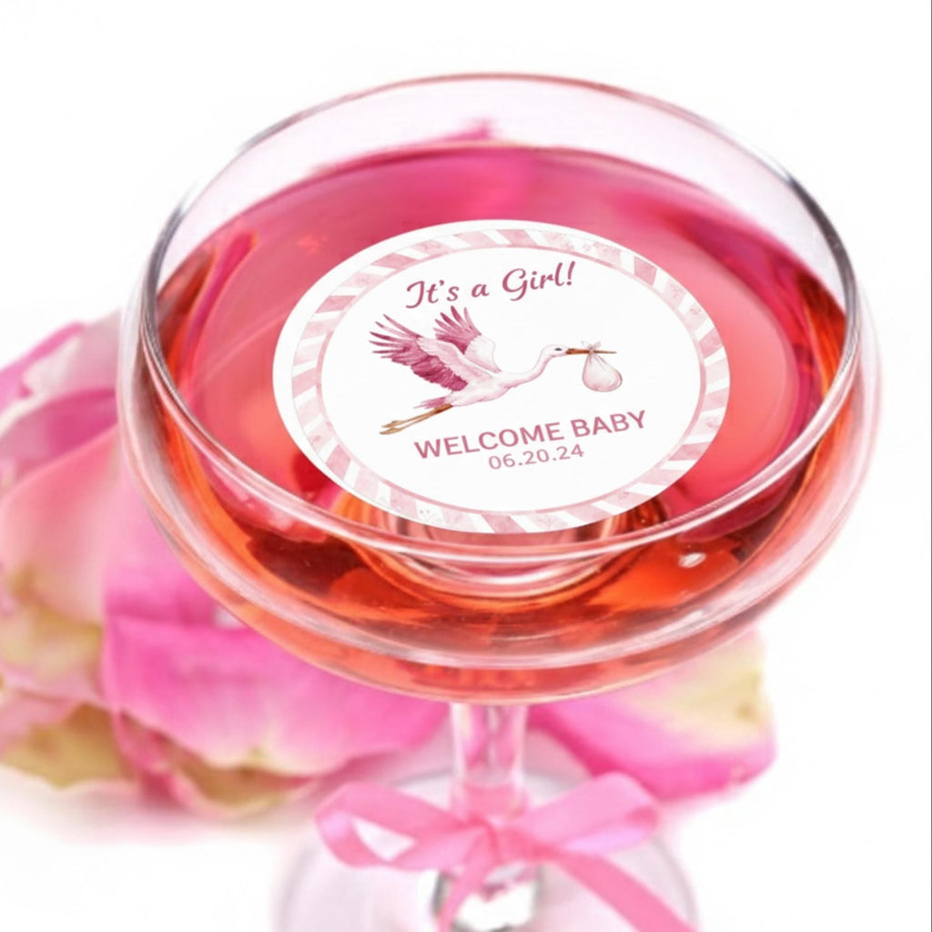 Baby shower edible drink toppers featuring a stork design printed on wafer paper circles, available in pink and blue themes for baby girl or boy celebrations. These precut edible toppers float on coffee, milk foam, mocktails, and party drinks, adding a cute and festive touch to gender reveal and baby shower events. Made with food-safe edible ink, they enhance beverage presentation and create a soft, decorative, and photo-ready party detail for special occasions.