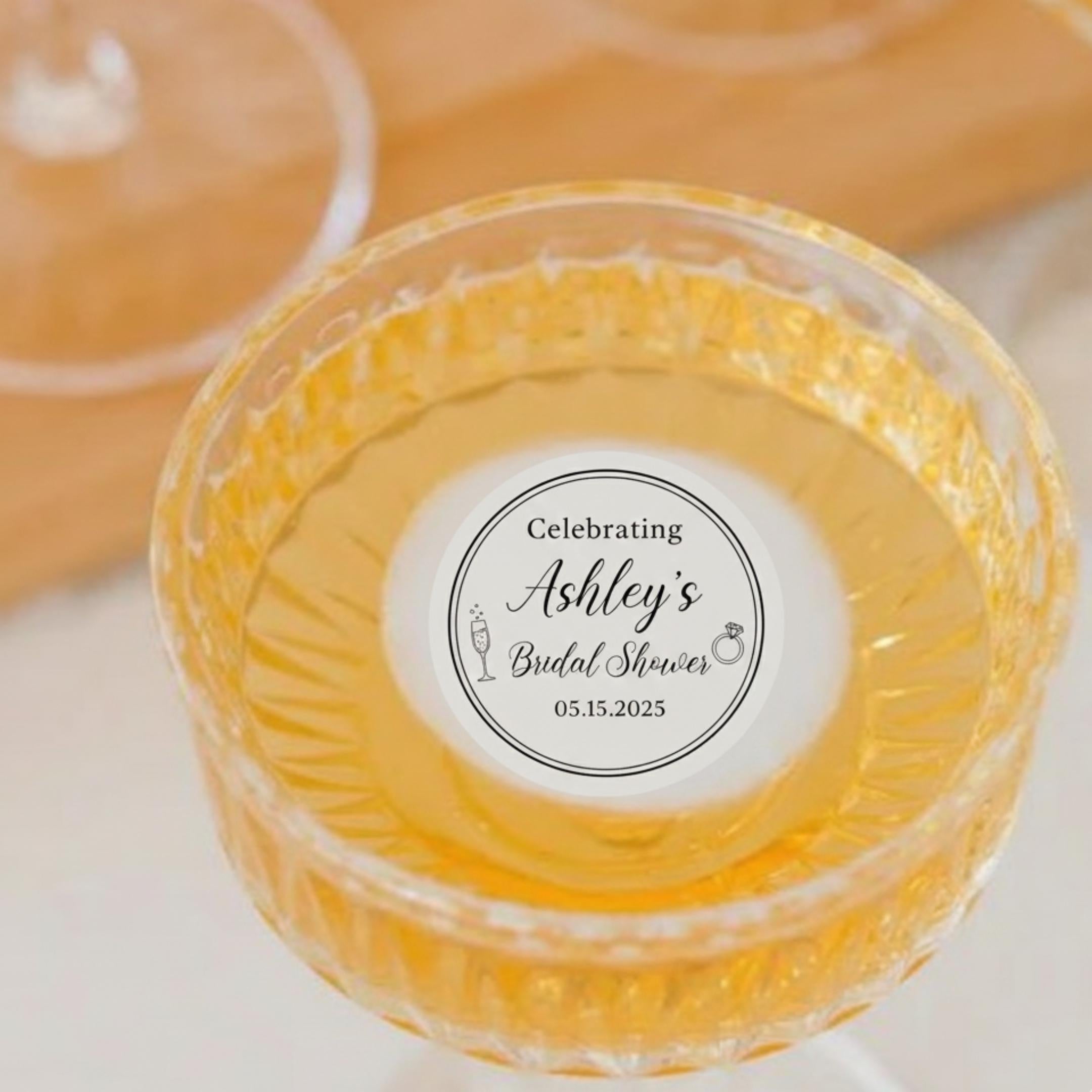 Set of 24 personalized bridal shower drink toppers made of edible wafer paper with elegant designs for cocktail decorations.