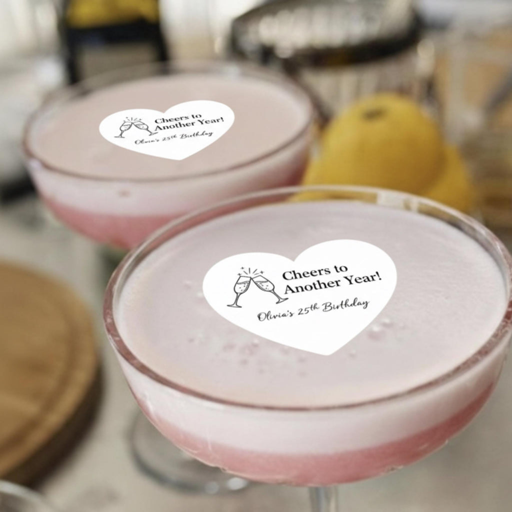 Set of 24 custom heart-shaped edible drink toppers made of wafer paper by SugarPrints for weddings and Valentine's Day.
