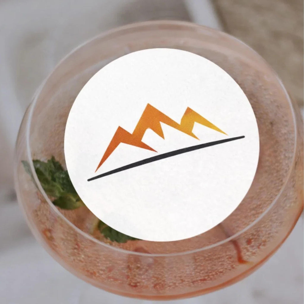 Edible wafer paper drink toppers with custom logo designs by SugarPrints for corporate event beverages.