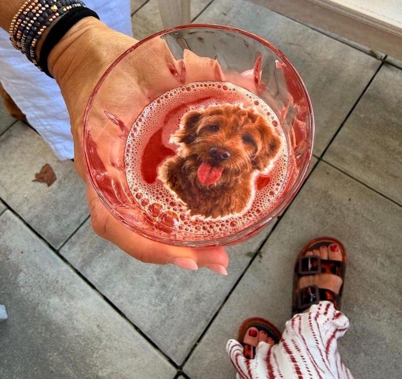 Custom pet portrait edible drink topper, cut out wafer disc floating on latte foam.