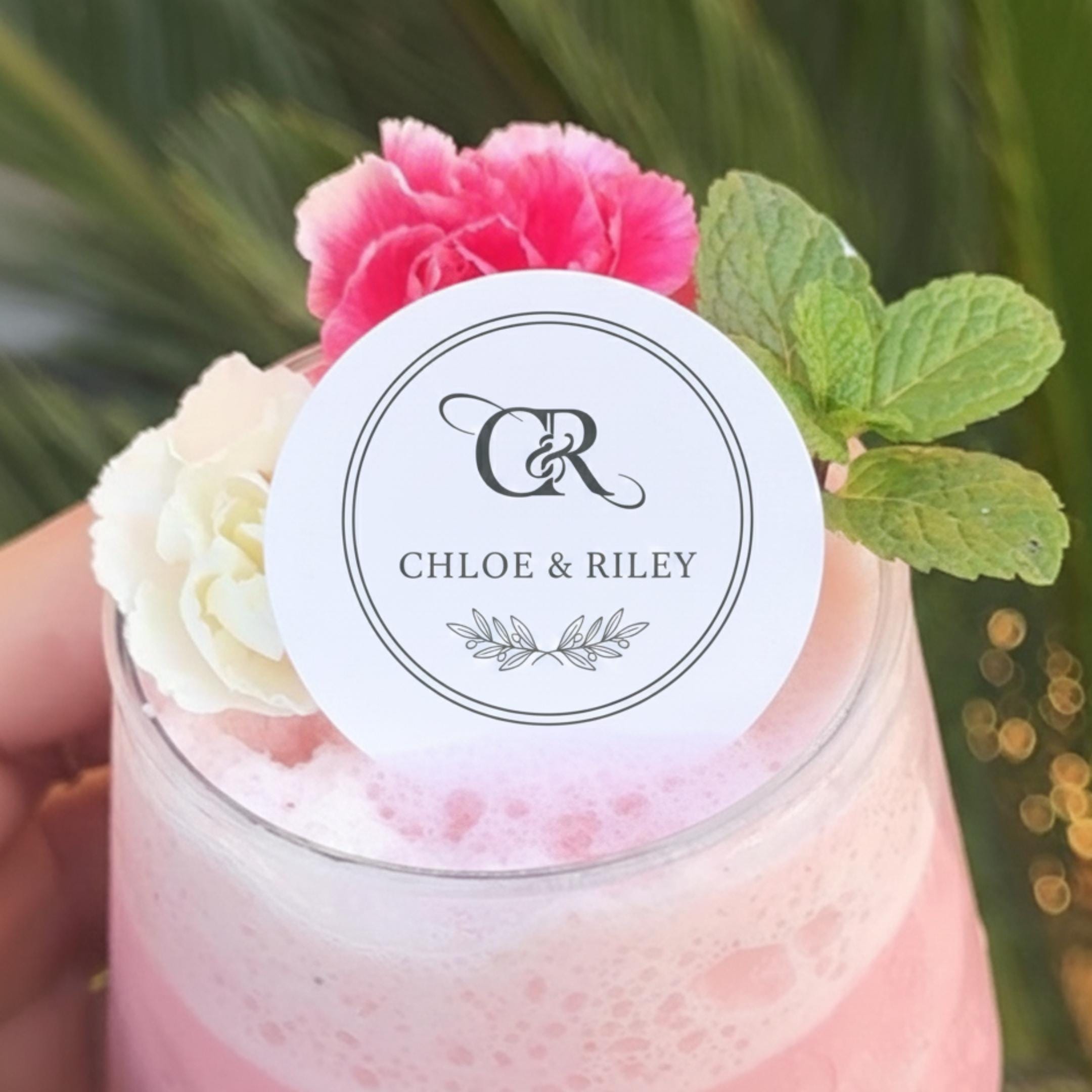 Custom wedding drink topper by SugarPrints featuring edible wafer paper circles with monogram name for cocktail decorations.