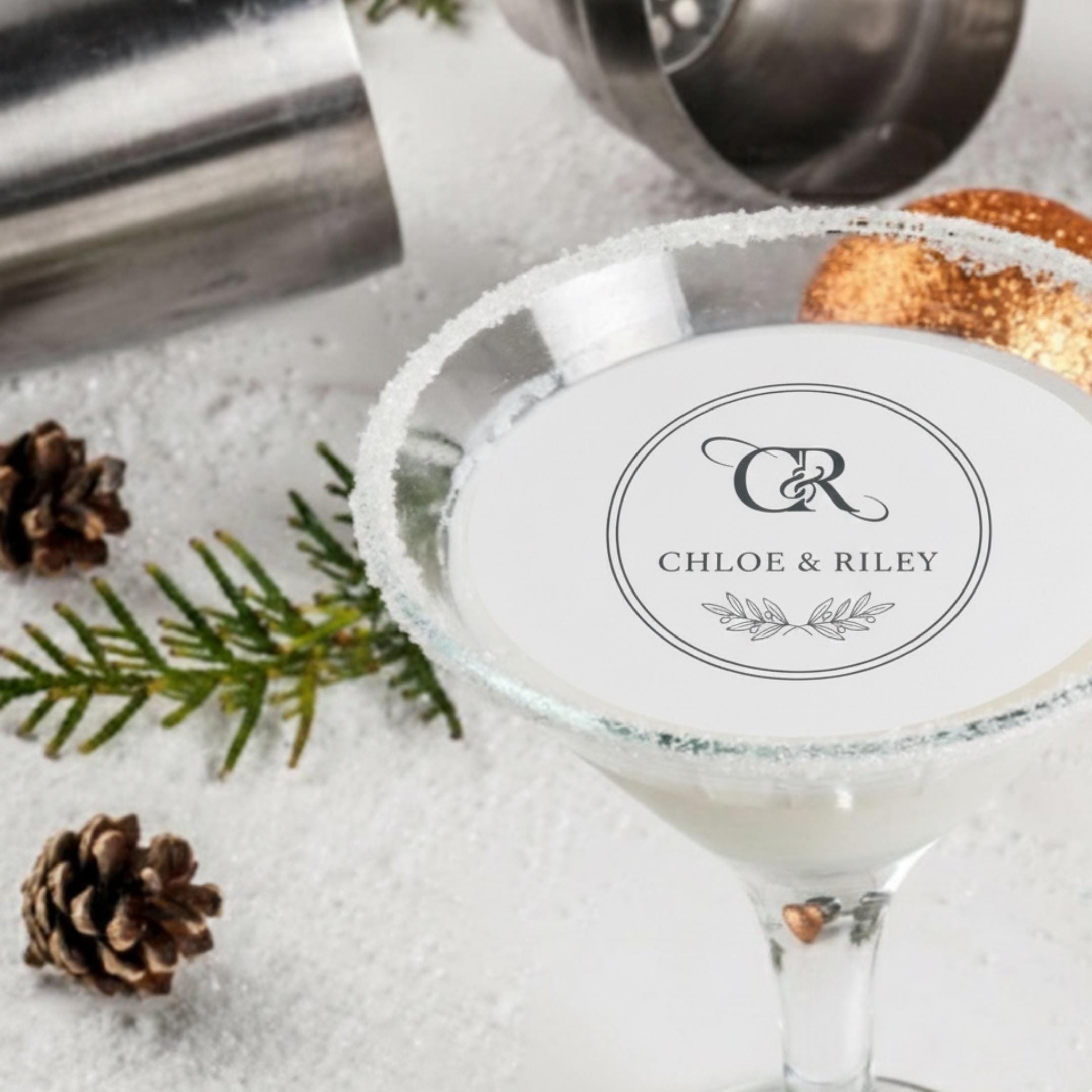 Custom wedding drink topper featuring edible wafer paper circles with monogram name, perfect for cocktail floating decorations.
