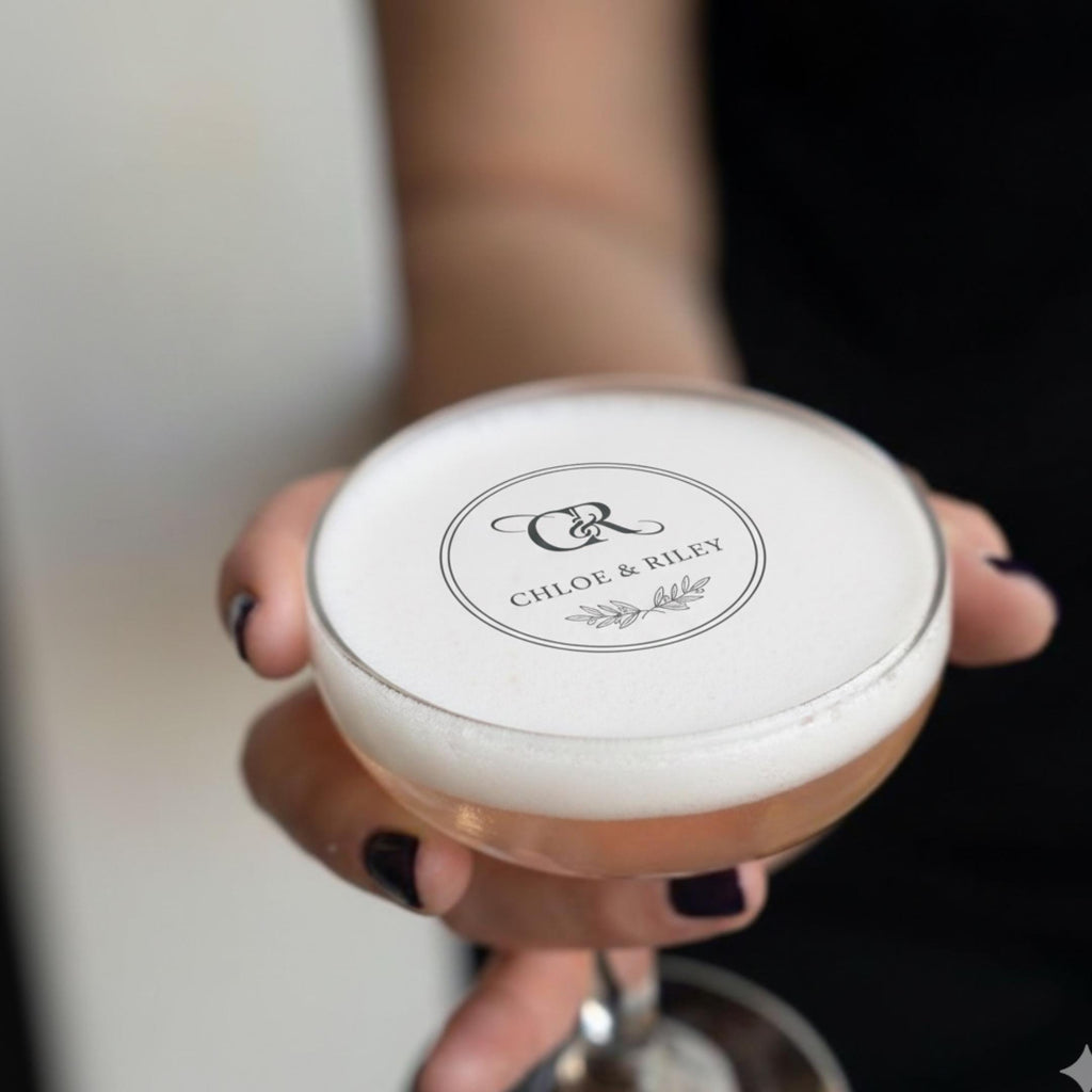 Custom wedding drink topper by SugarPrints, edible wafer paper circle with monogram, perfect for cocktail floating party decorations.