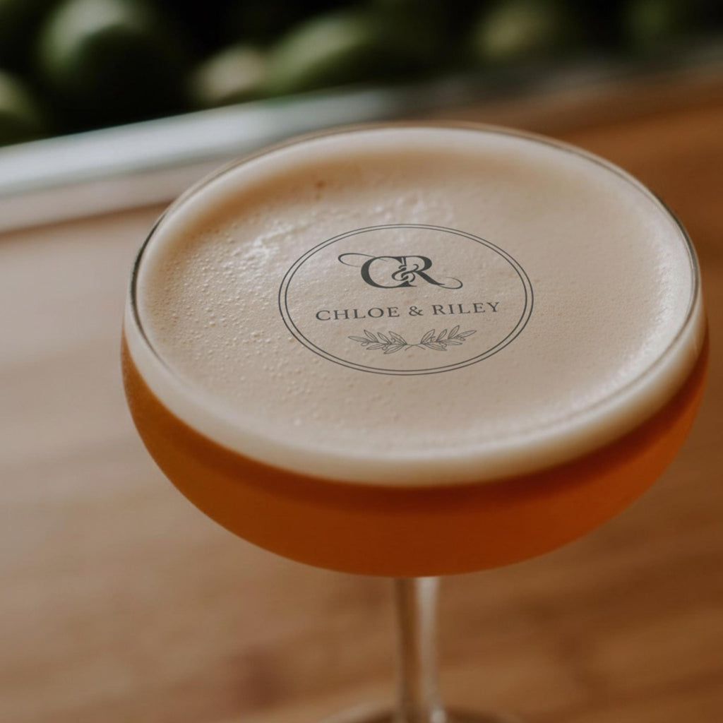 Custom wedding drink topper by SugarPrints featuring edible wafer paper circles with monogram name for cocktail decorations.