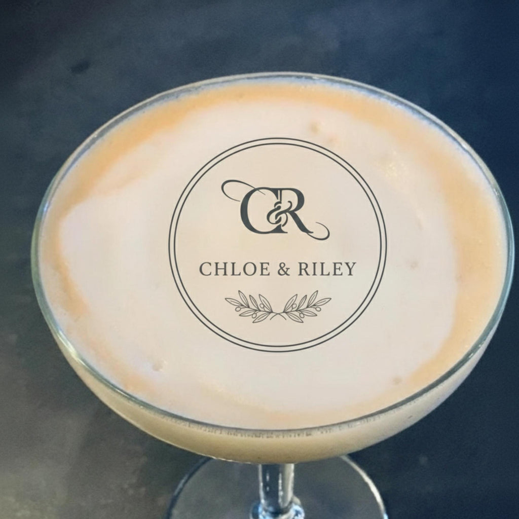 Custom wedding drink topper by SugarPrints featuring edible wafer paper circles with monogram name for cocktail decoration.