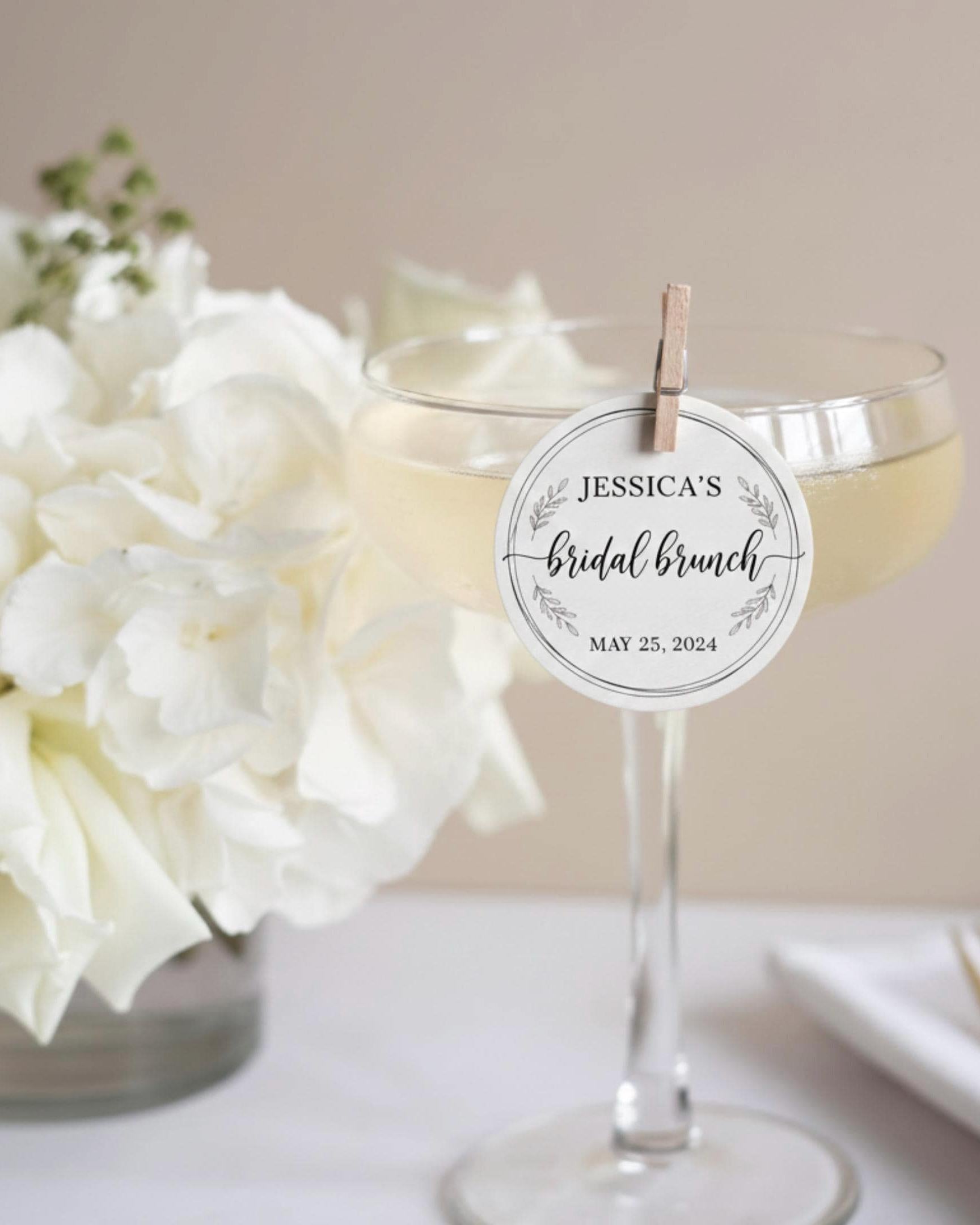 Wedding drink with a round edible wafer topper floating on latte foam.