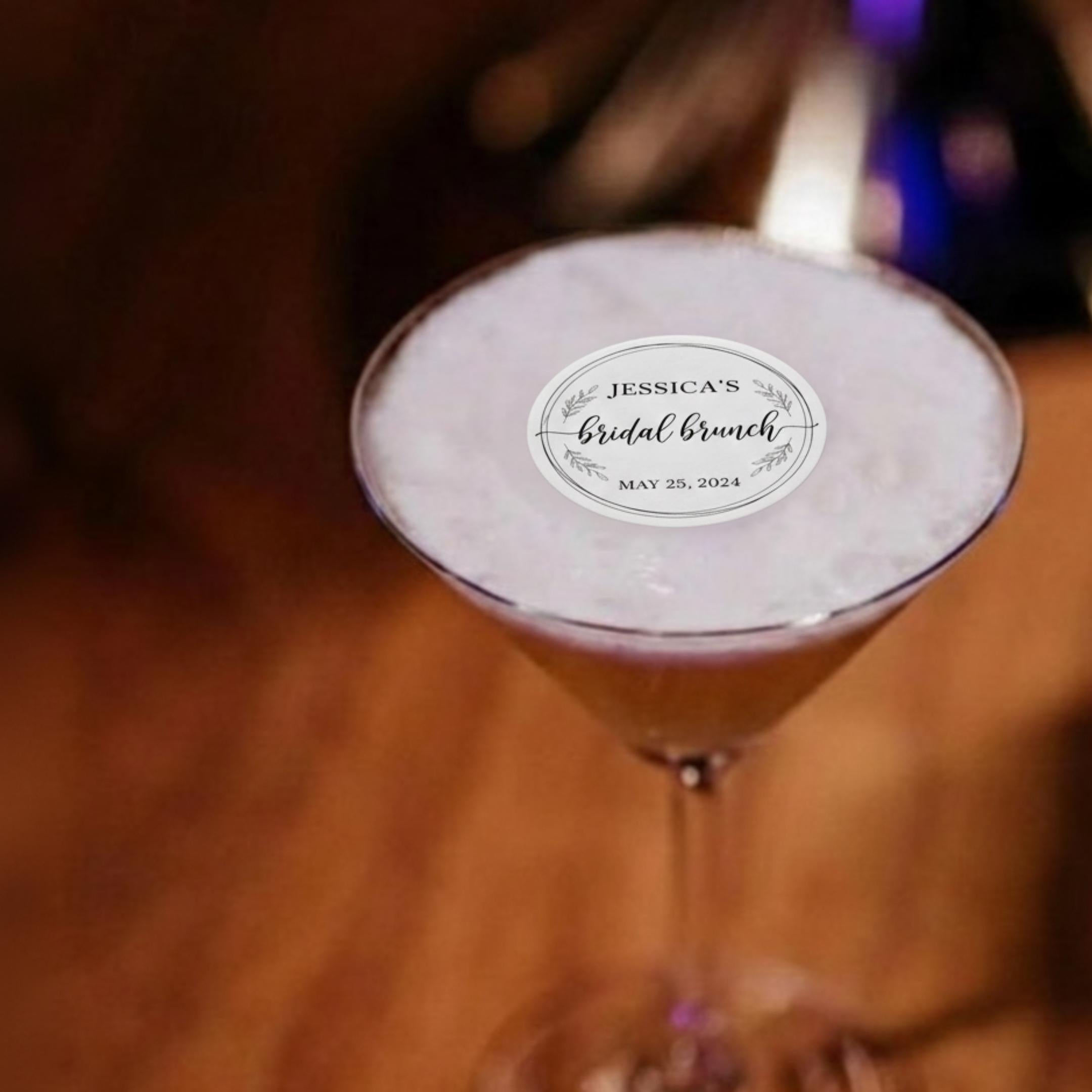 Wedding drink with a round edible wafer topper floating on latte foam.