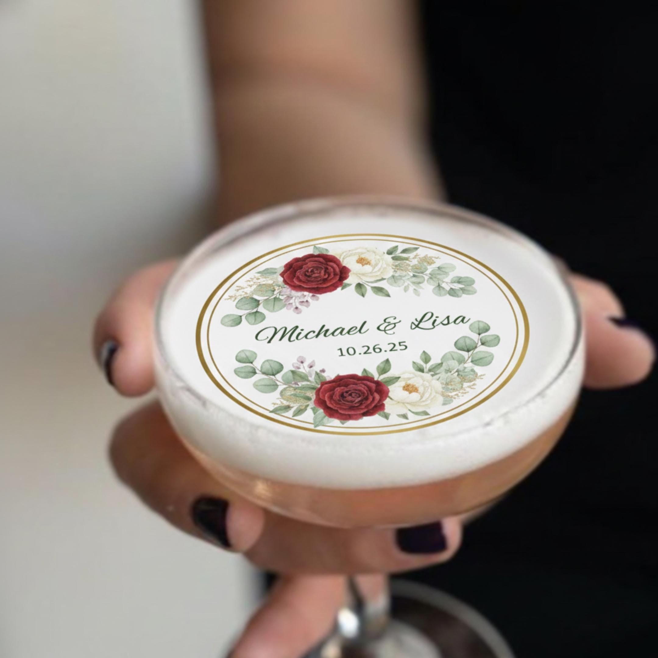 Set of 24 edible wafer paper floral wedding drink toppers with personalized names and date for signature cocktails.