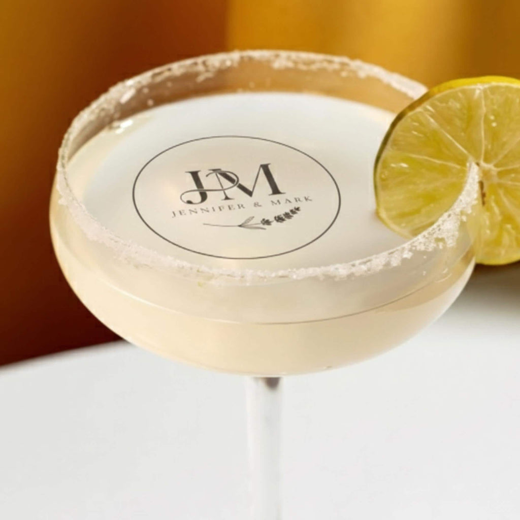 Personalized wedding drink topper by SugarPrints with custom initials on edible wafer paper, perfect for cocktail decorations.