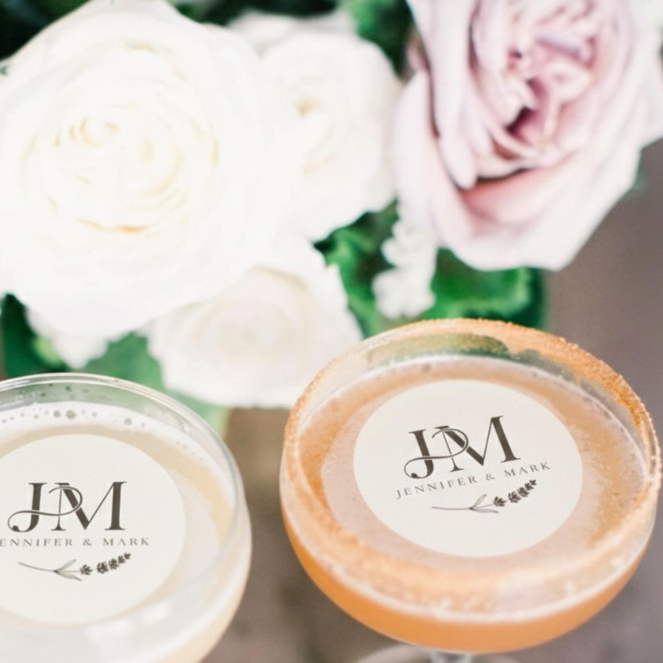 Personalized wedding drink toppers with custom initials on edible wafer paper, perfect for cocktail decorations by SugarPrints.