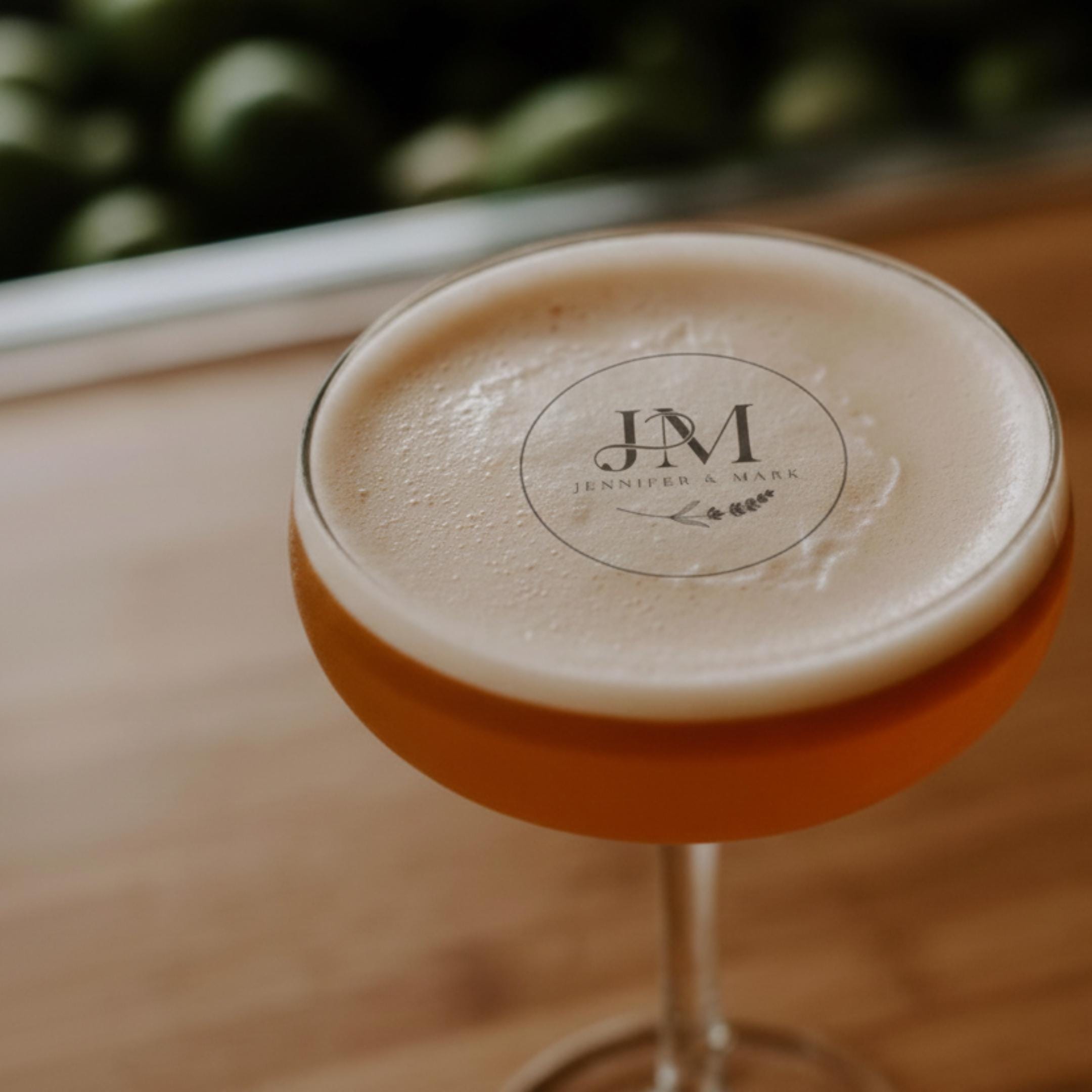 Personalized wedding drink topper with custom initials on edible wafer paper, designed as cocktail decorations by SugarPrints.